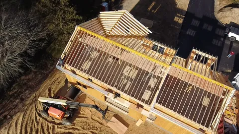Roof rafters going up on a new house, seen from above